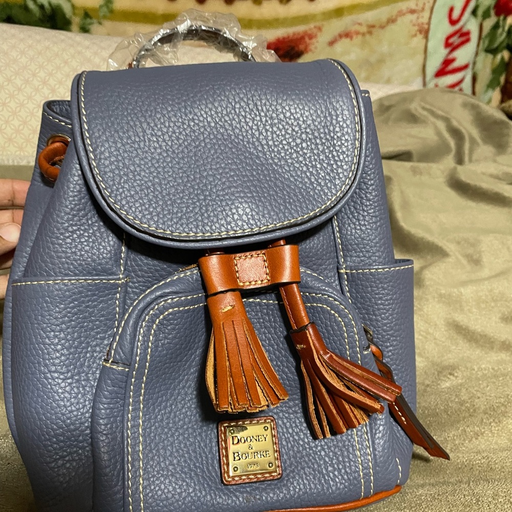 I am selling this NEVER USED Dooney & Bourke small pebble grain Murphy backpack.